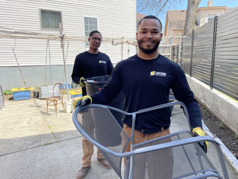Junk removal professionals removing outdoor furniture for residents in Wakefield