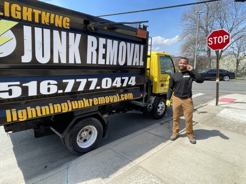 Junk removal professionals scheduling couch removal services over the phone