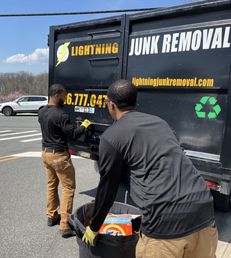 Lightning Junk Removal crew loading trash onto the truck during junk removal services in Mamaroneck, NY