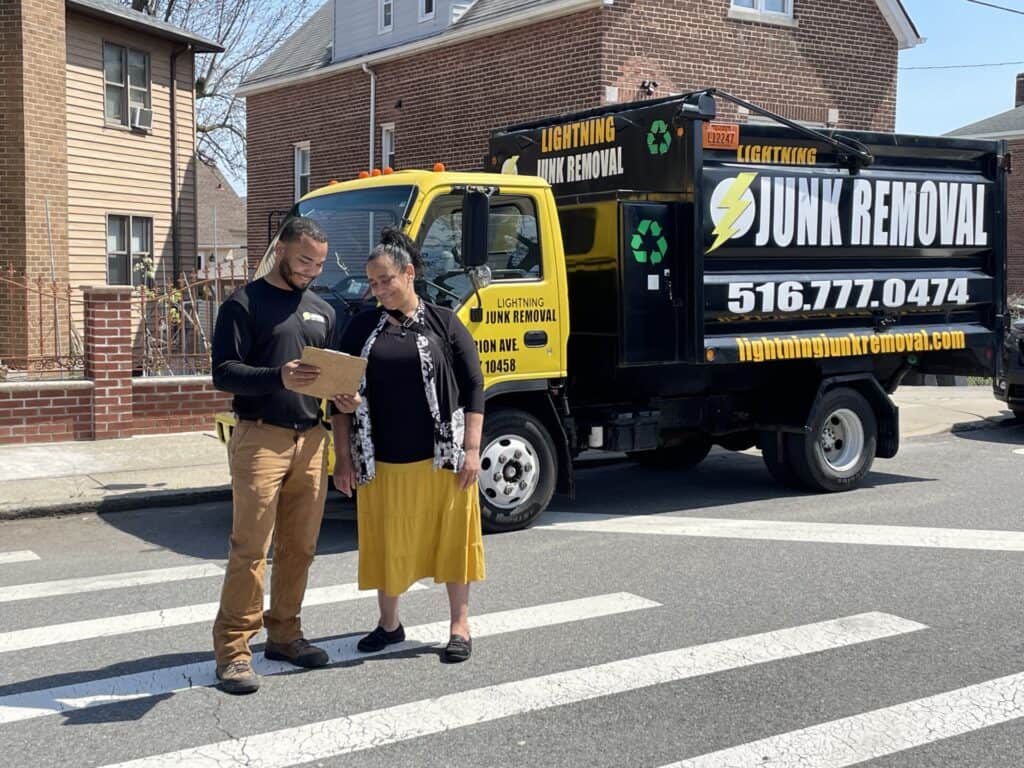 Lightning Junk Removal professional explaining the junk removal process to a happy customer